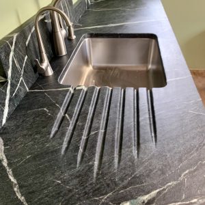 Pacific Soapstone countertop with custom backsplash and runnels 