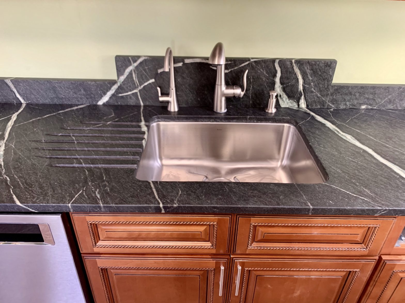 Pacific Soapstone countertop with custom backsplash and runnels