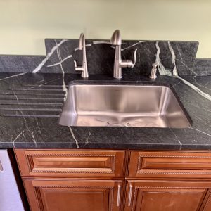 Pacific Soapstone countertop with custom backsplash and runnels 