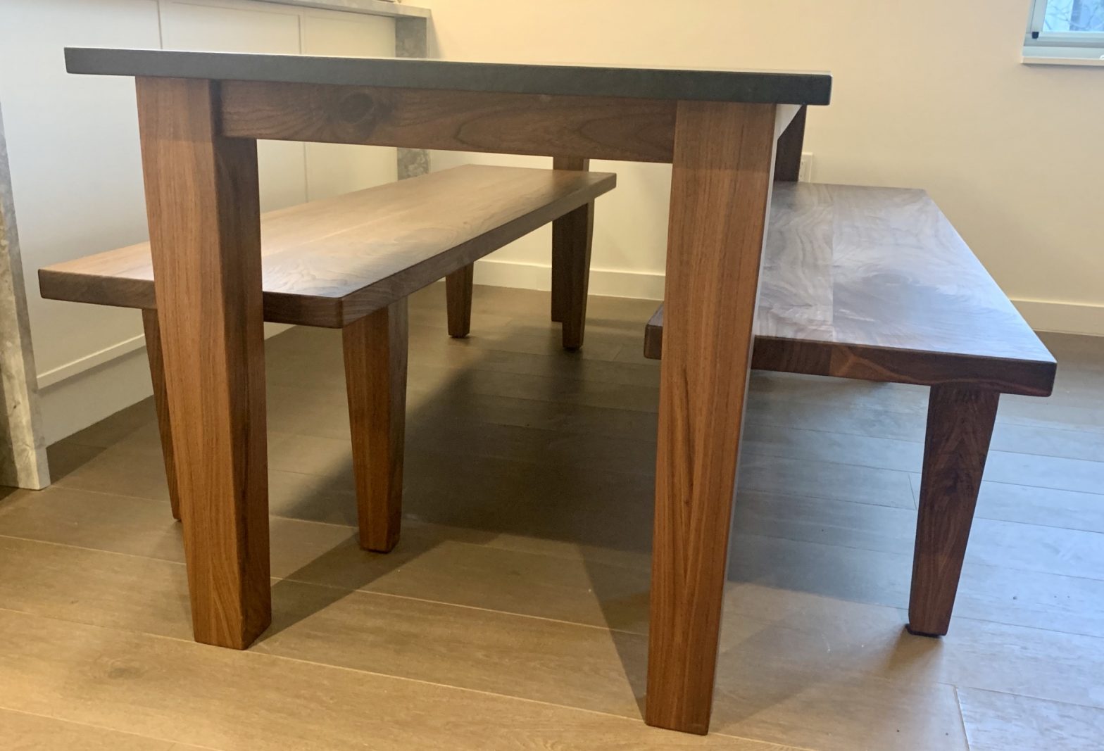 Custom Black Walnut table with benches and custom Churchill Soapstone table top