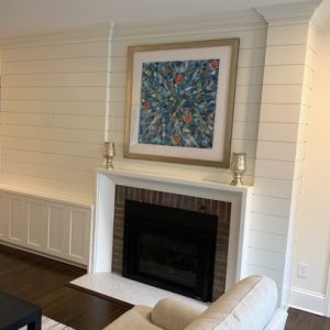 fire place surround and shaker doors cabinets with shiplap back