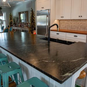 Pacific Soapstone Apron Farmhouse Sink with Runnels on Countertop 