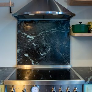 Pacific Soapstone Full Backsplash Behind Stove 