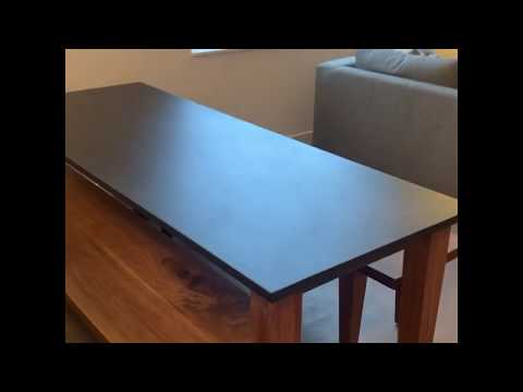 Custom Black Walnut table base with benches and Churchill Soapstone table top.