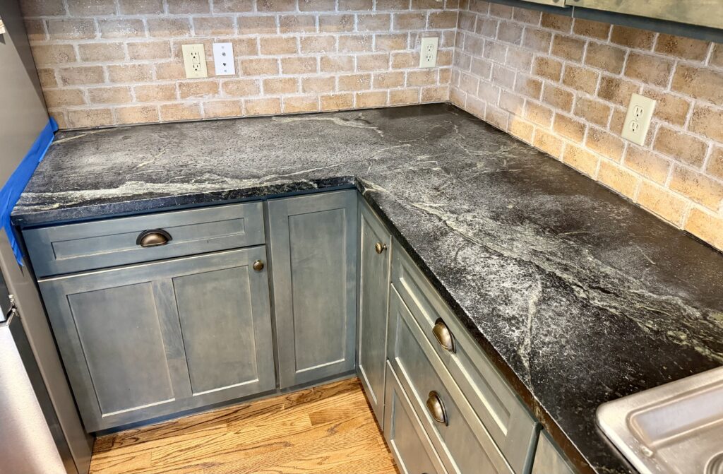 Original soapstone finish before restoration work in Westfield