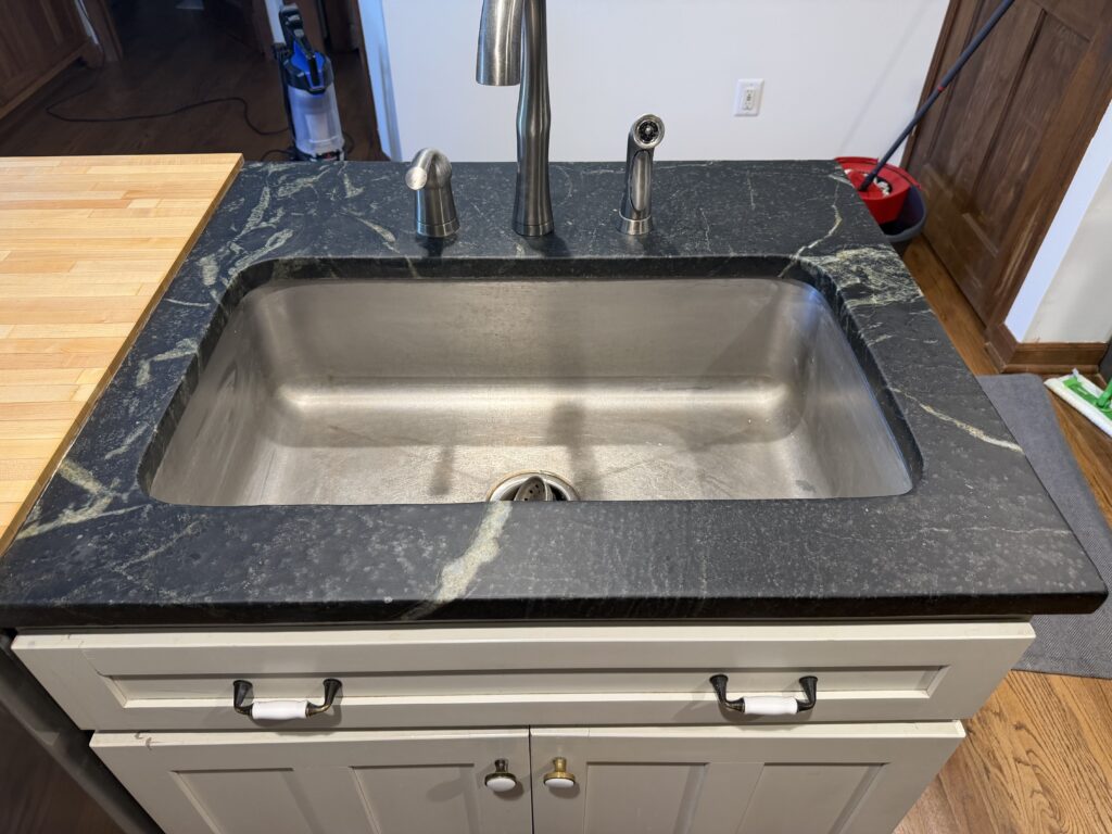 Refinished soapstone countertop with wax finish in Westfield