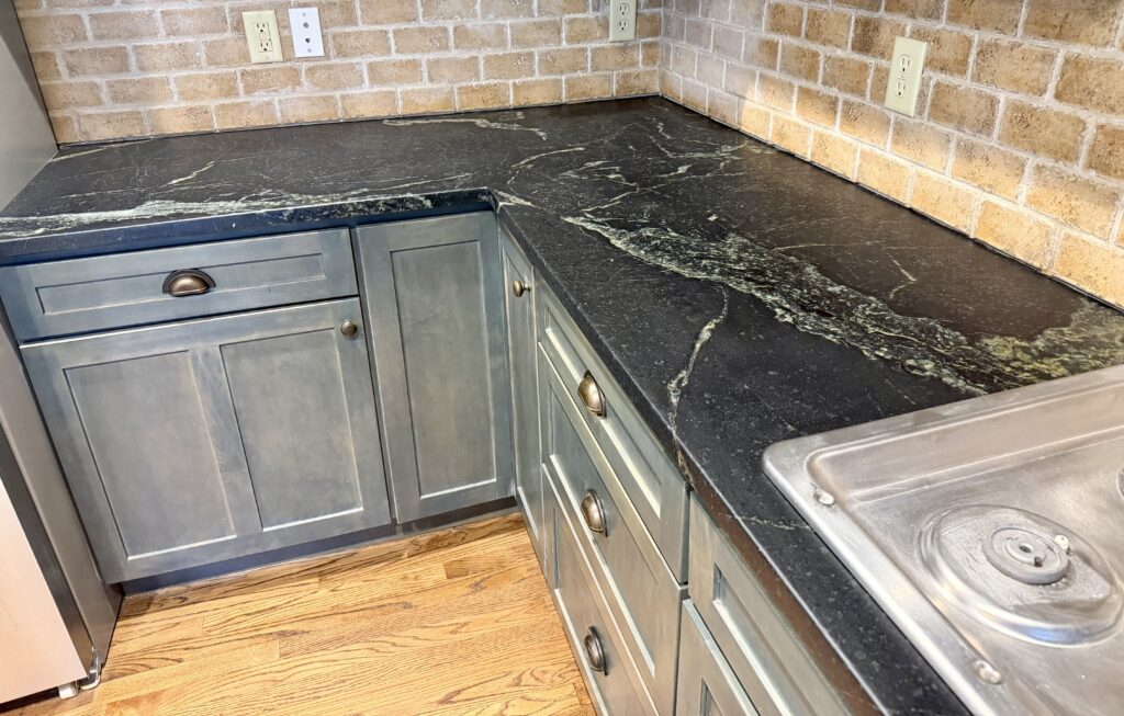 Restored soapstone surface with rich wax finish in Westfield