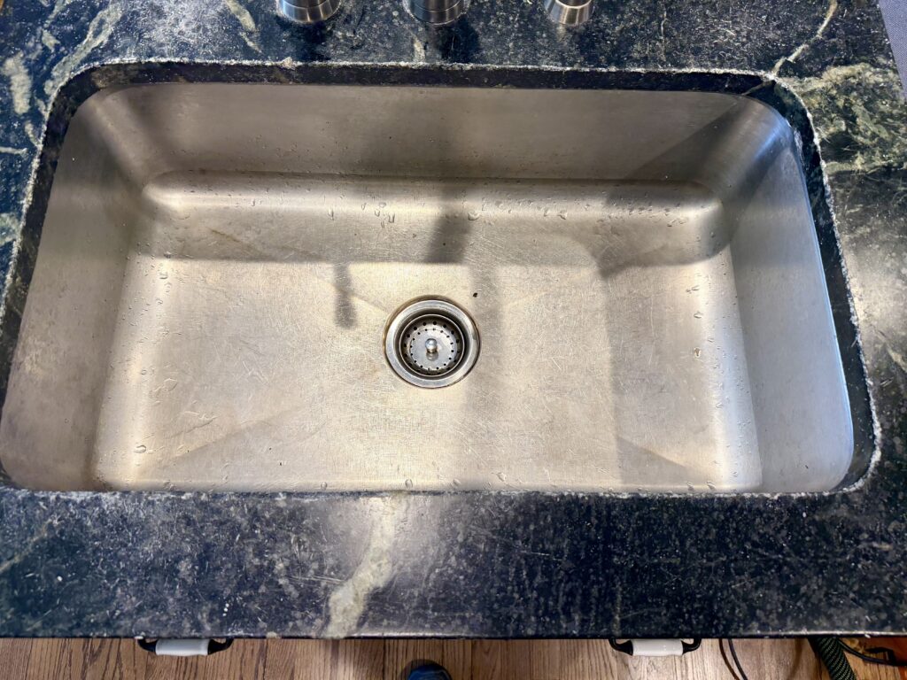 Soapstone countertop prior to sanding and refinishing in Westfield