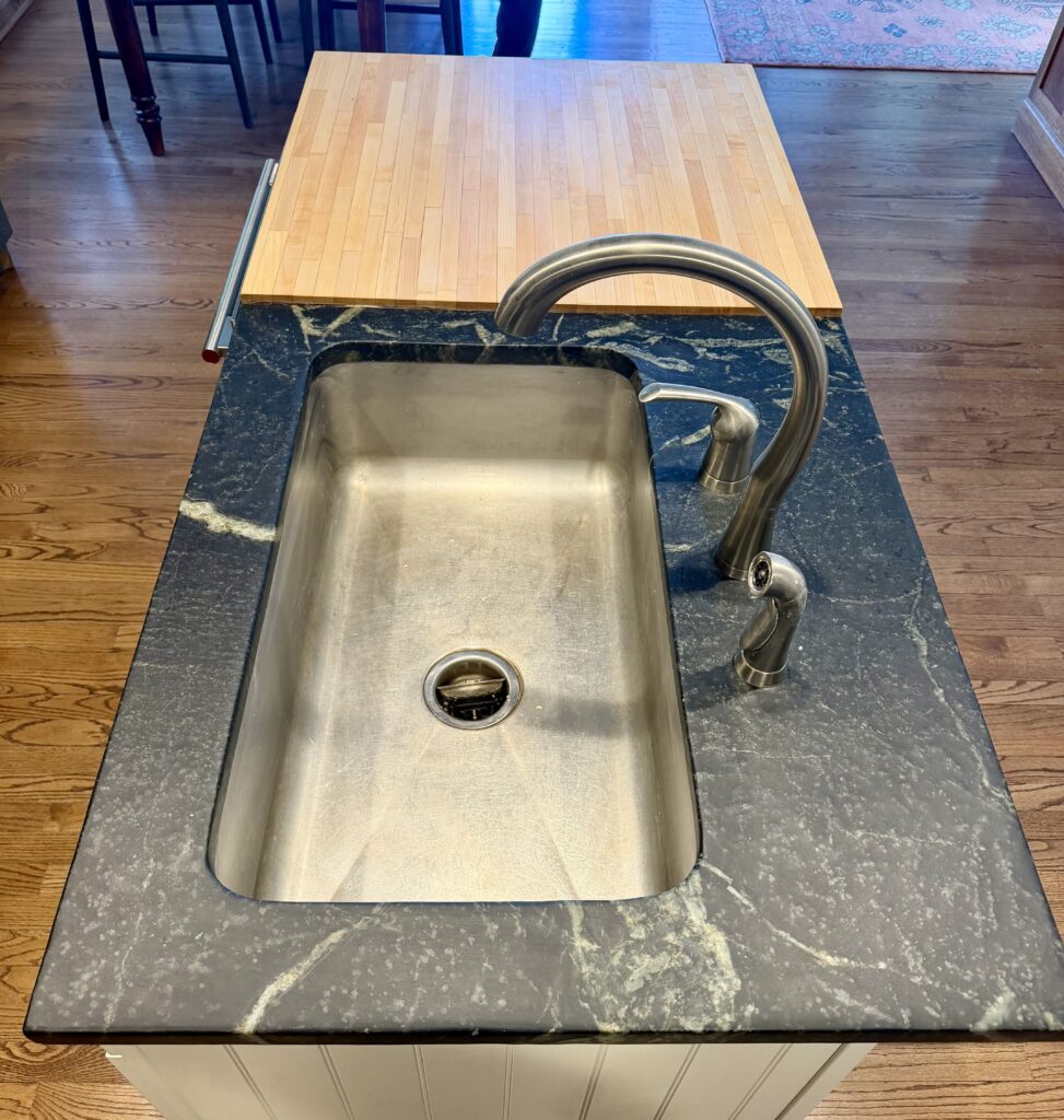 Soapstone surface enhanced with wax finish after refinishing in Westfield